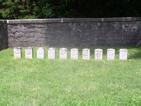 The graves of fallen soldiers surround the Hazen Brigade Monument.